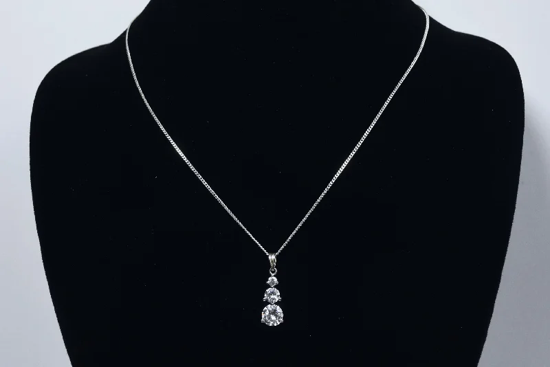 Ladies Necklaces with Red Pyroxmangite-Avon - Sterling Silver Graduated Cubic Zirconia Drop Pendant on Sterling Silver Chain Necklace - 16"