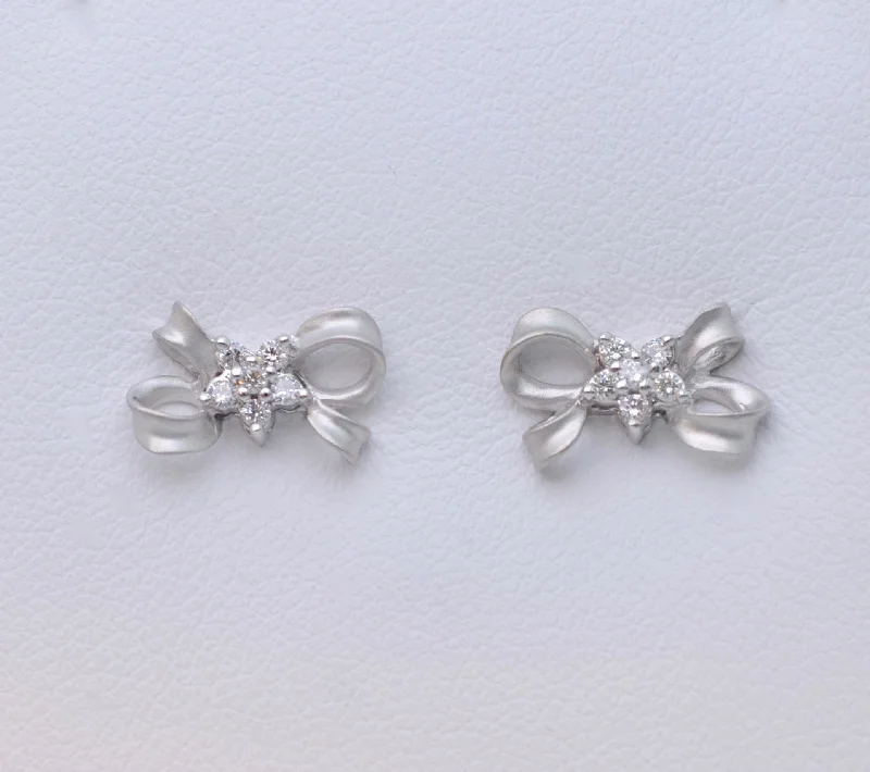 Ladies confident shine earrings -Bow-shaped Post Earrings with Diamond Accents in 14K White Gold